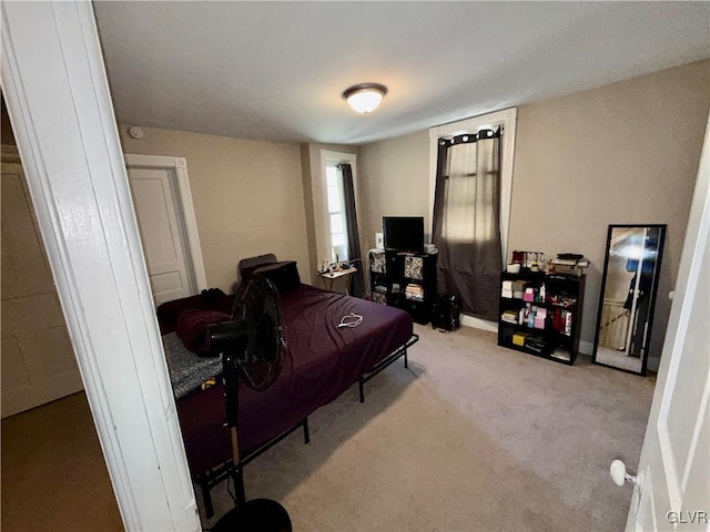 bedroom featuring baseboards and carpet flooring