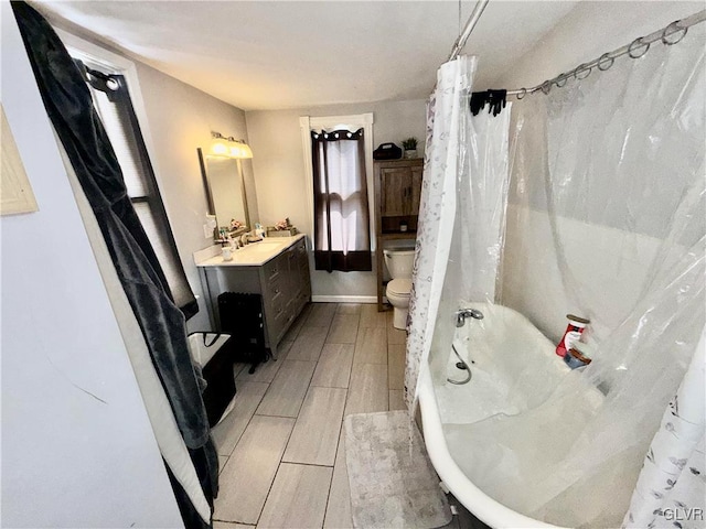 full bath featuring vanity, shower / bath combination with curtain, toilet, and wood finish floors