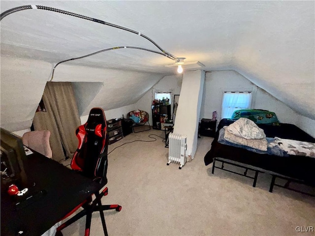 carpeted bedroom featuring vaulted ceiling