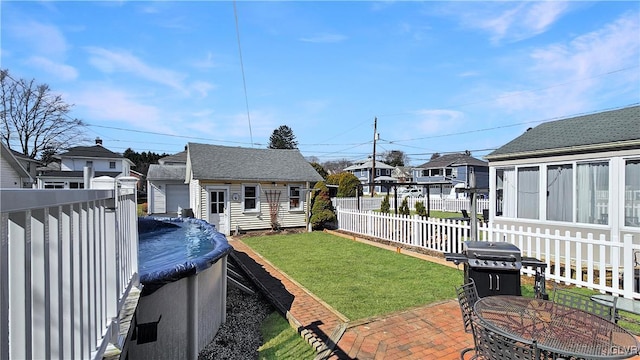 view of yard with a fenced in pool, a residential view, an outdoor structure, a fenced backyard, and a patio area