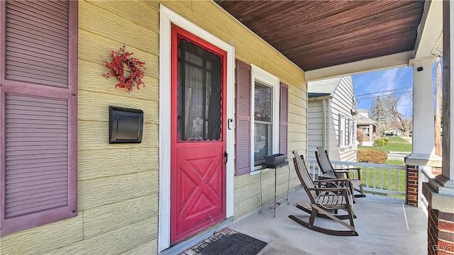 property entrance featuring covered porch