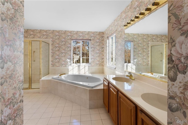 bathroom with tile patterned flooring, a shower stall, wallpapered walls, and a sink