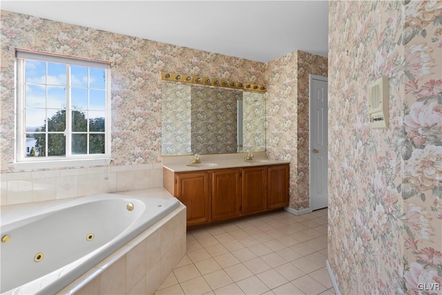 bathroom featuring tile patterned flooring, a jetted tub, wallpapered walls, and vanity