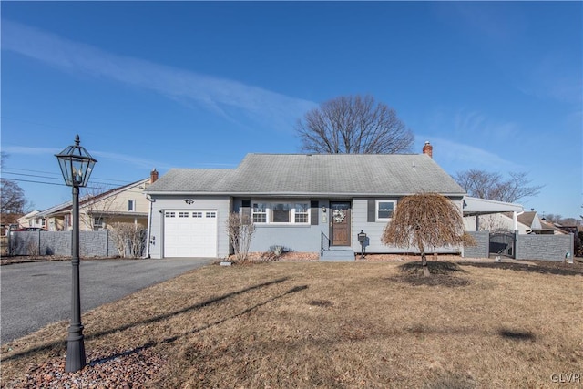 single story home with driveway, a gate, fence, a front yard, and a garage