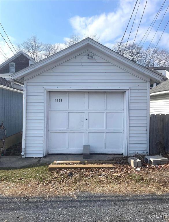 garage with fence