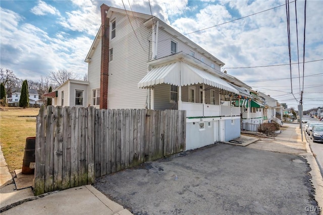 view of property exterior with fence