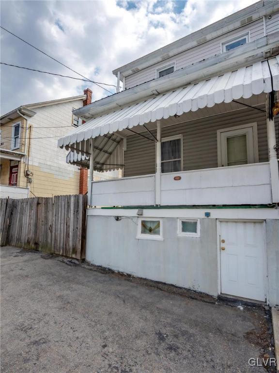 view of side of home with fence