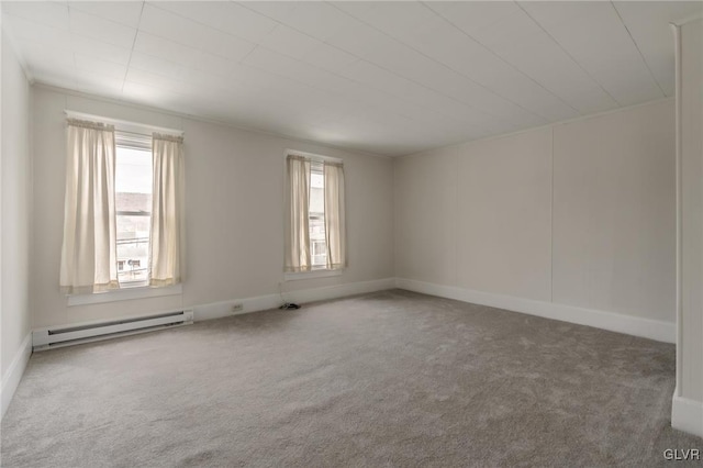 spare room with a baseboard radiator, plenty of natural light, and carpet floors