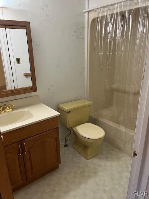 full bathroom with tile patterned floors, vanity, toilet, and shower / tub combo with curtain