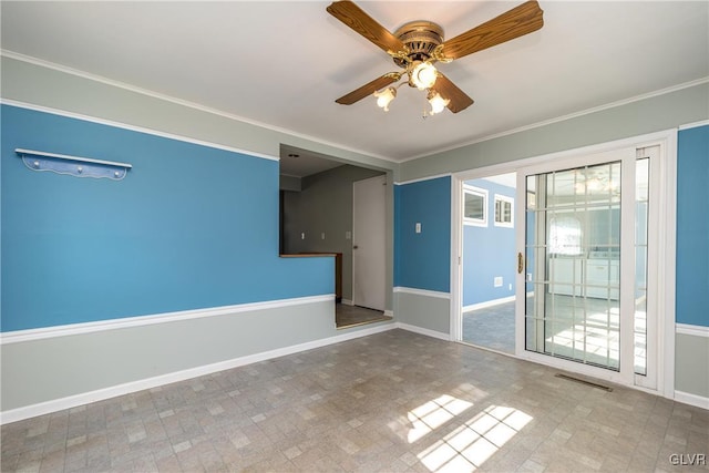 spare room featuring visible vents, baseboards, ceiling fan, and ornamental molding