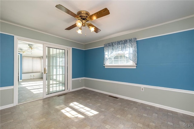 empty room featuring visible vents, baseboards, crown molding, and ceiling fan