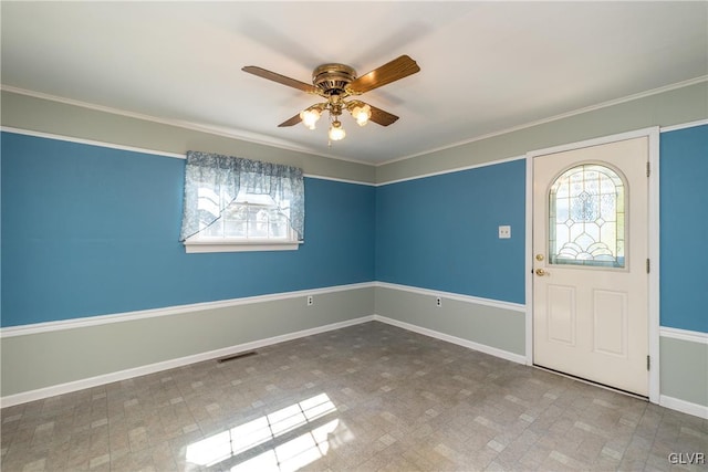 entrance foyer with visible vents, baseboards, a healthy amount of sunlight, and a ceiling fan