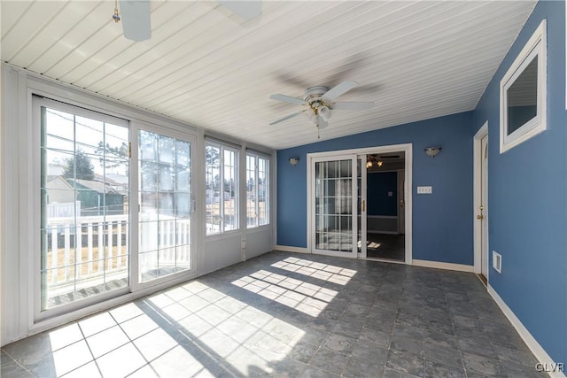 unfurnished sunroom with ceiling fan