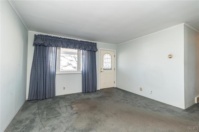 carpeted spare room featuring crown molding