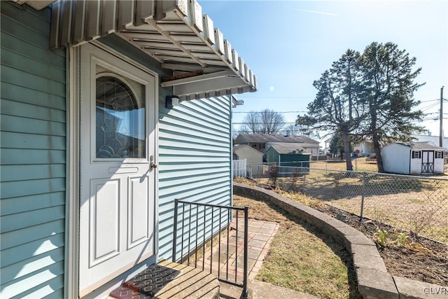 doorway to property with fence