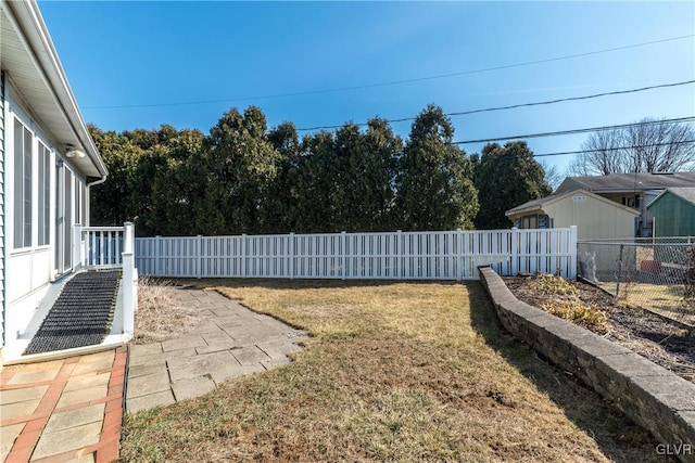 view of yard with a fenced backyard