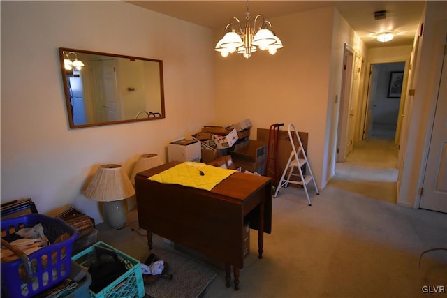 dining room with a notable chandelier and carpet