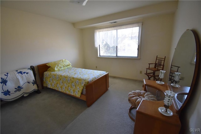 bedroom with light carpet, visible vents, and baseboards