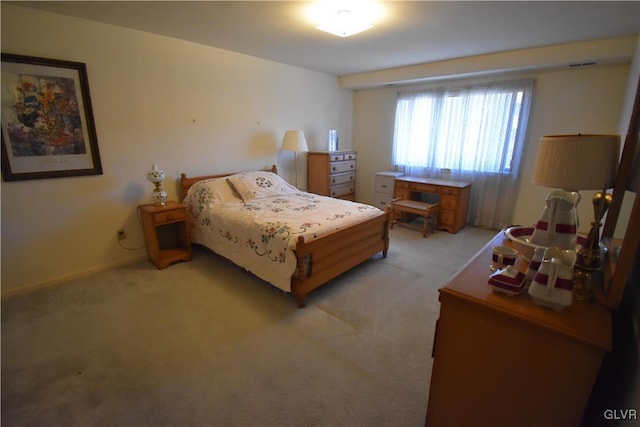 bedroom with light colored carpet