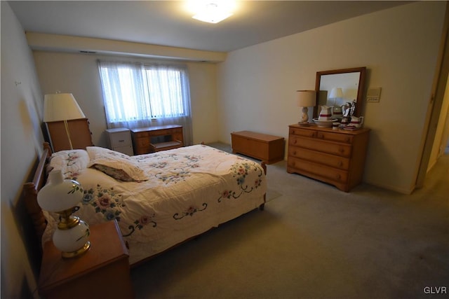 bedroom with light colored carpet