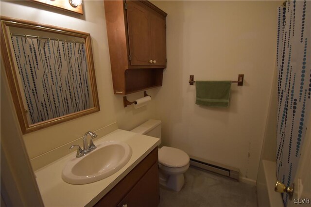 bathroom with baseboard heating, toilet, and vanity