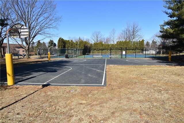 view of sport court with community basketball court and fence