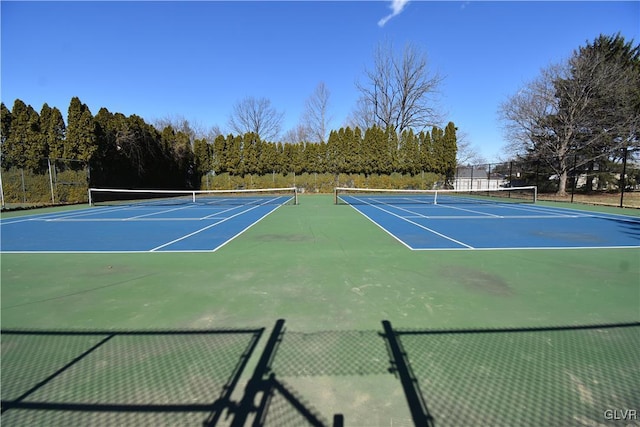 view of sport court featuring community basketball court and fence