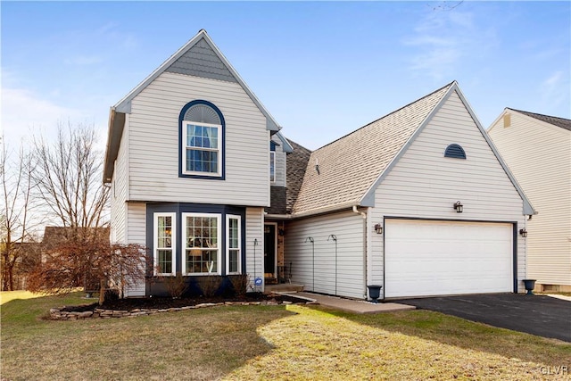 view of front of home with aphalt driveway, a front lawn, a garage, and a shingled roof