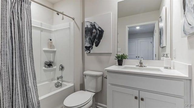 full bath with toilet, shower / bath combo, and vanity