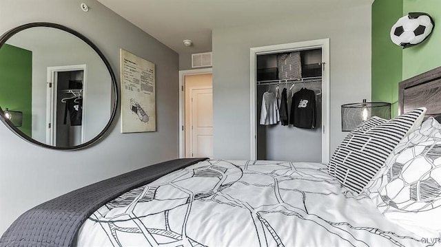 bedroom with a closet, visible vents, and a spacious closet