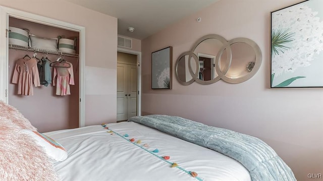 bedroom with visible vents and a closet