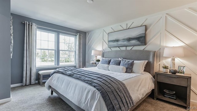 bedroom with baseboards and carpet flooring