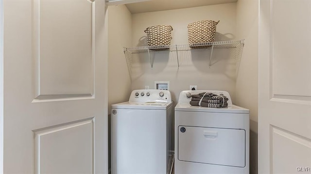 washroom with laundry area and separate washer and dryer