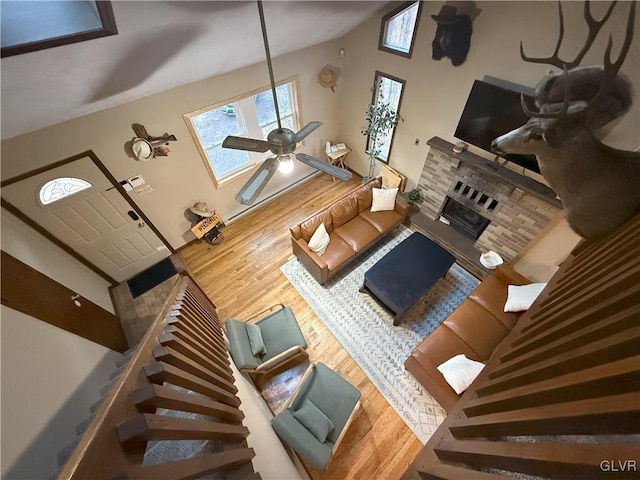 248 Penn Forest Trl, Penn Forest Township, PA 18210 - living area featuring stairway, a fireplace, ceiling fan, and wood finished floors
