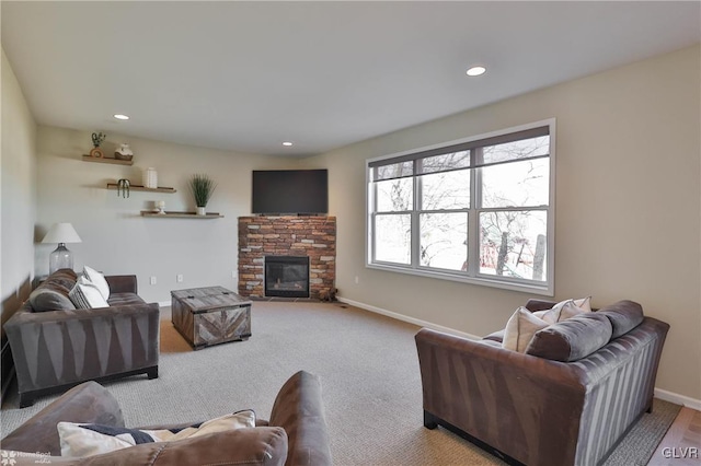 carpeted living area featuring recessed lighting, a fireplace, and baseboards