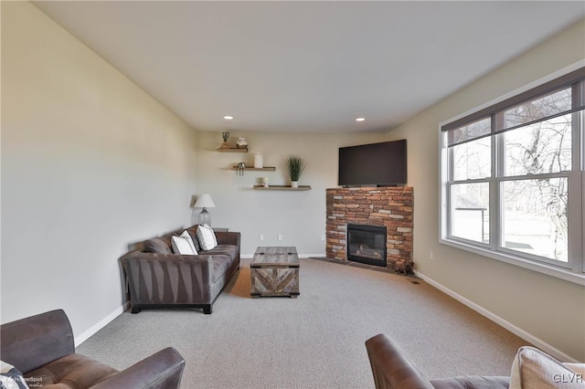 living area featuring recessed lighting, a fireplace, baseboards, and carpet floors