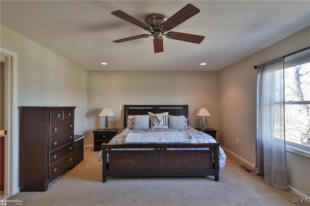 bedroom featuring recessed lighting, baseboards, light colored carpet, and a ceiling fan