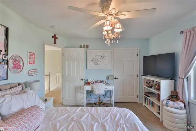 bedroom featuring light carpet, visible vents, and a ceiling fan