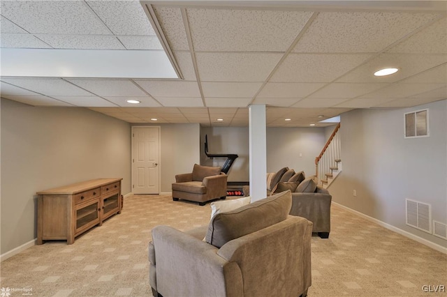 living room featuring light carpet, visible vents, and baseboards