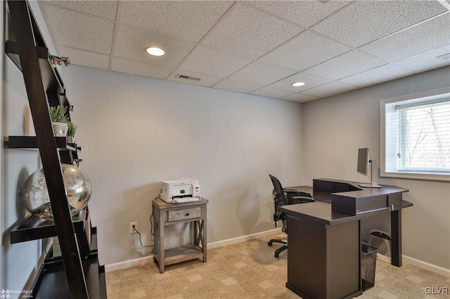 office space with visible vents, baseboards, recessed lighting, a drop ceiling, and light colored carpet