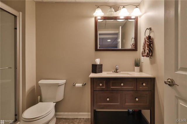 full bathroom with vanity, toilet, baseboards, and a shower with shower door