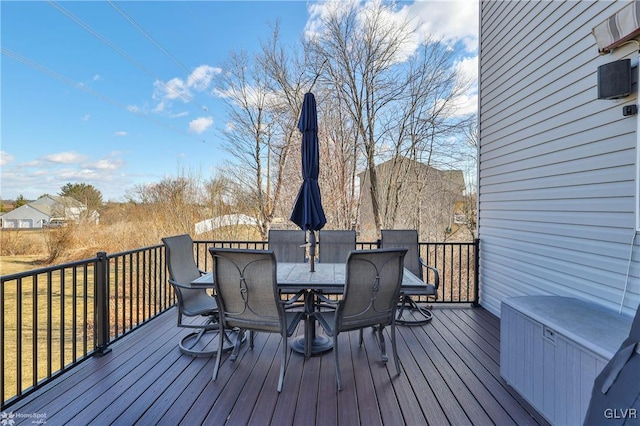 deck with outdoor dining area