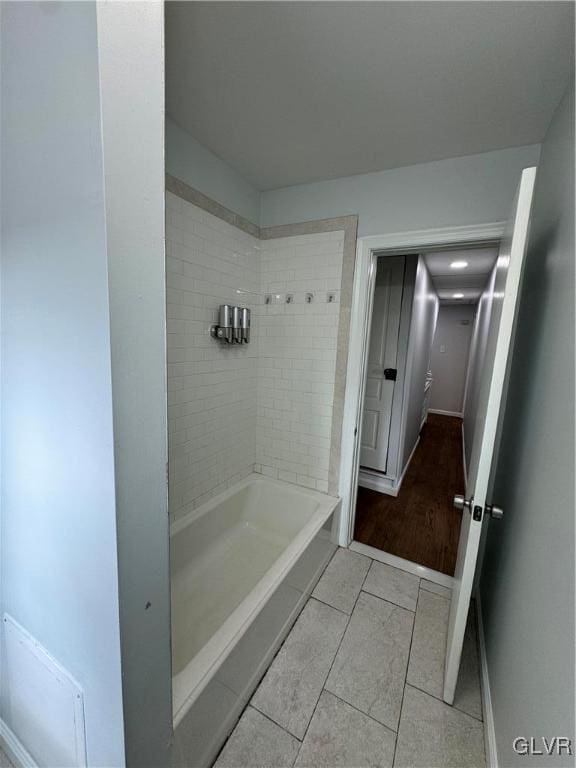 bathroom with tile patterned flooring and baseboards