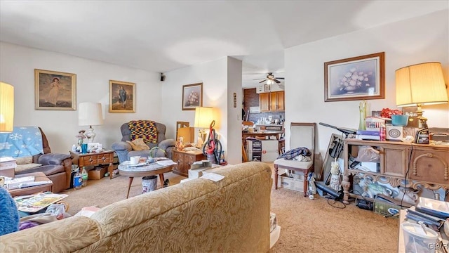 carpeted living room featuring ceiling fan