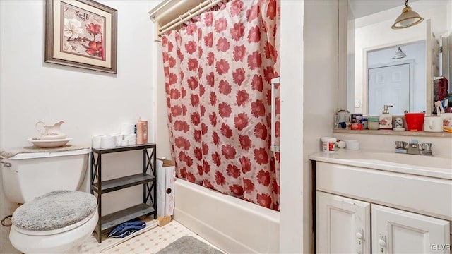 full bathroom featuring toilet, vanity, and shower / bath combination with curtain