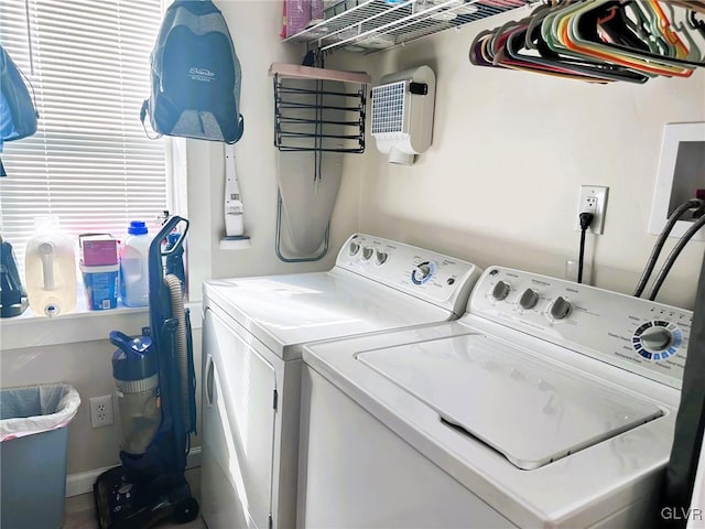 laundry room featuring independent washer and dryer and laundry area