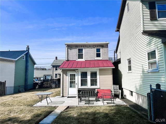 back of house with a patio area, a yard, and fence