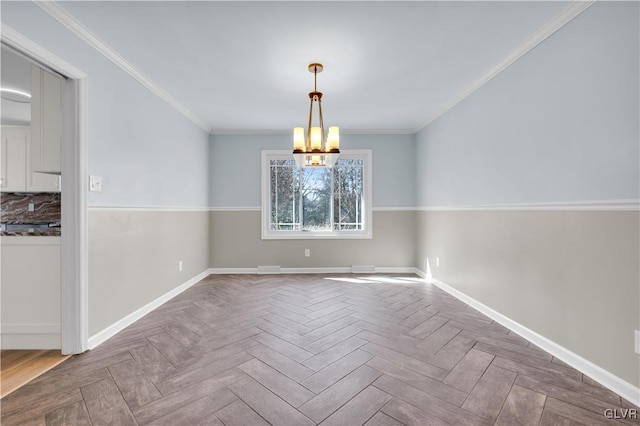 unfurnished dining area with baseboards, a notable chandelier, and ornamental molding