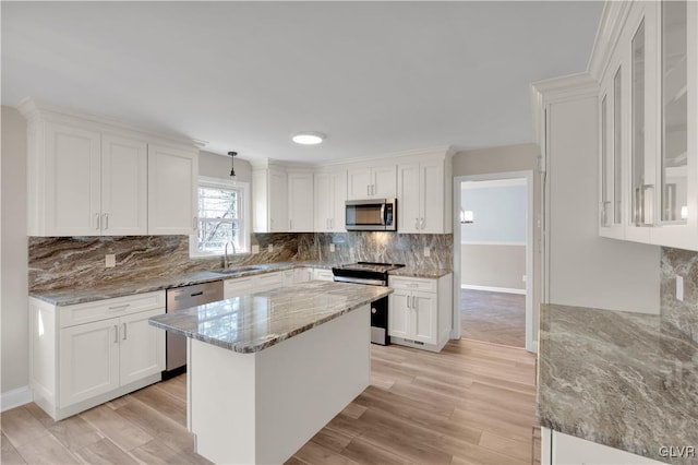 kitchen featuring white cabinetry and appliances with stainless steel finishes