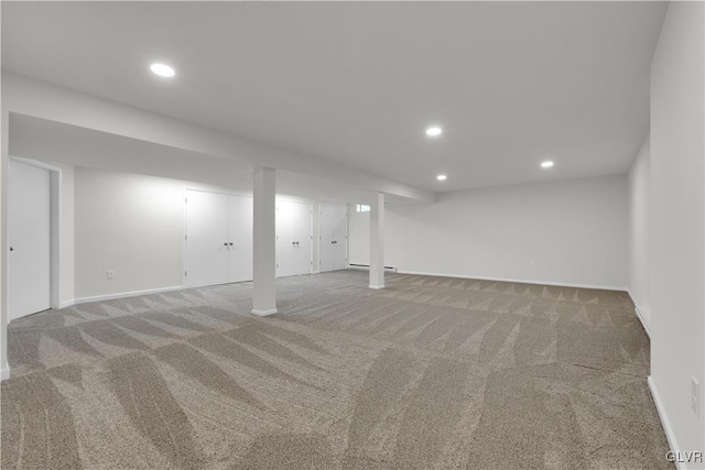 finished basement with recessed lighting, baseboards, and carpet floors